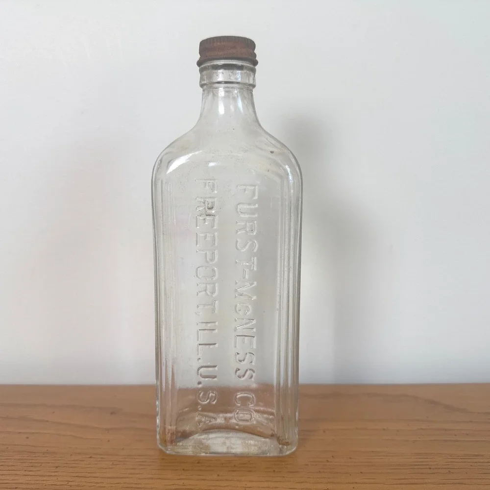 Vintage Furst-McNess Co‎ Freeport ILL USA Embossed Clear Glass Bottle Rusty Cap